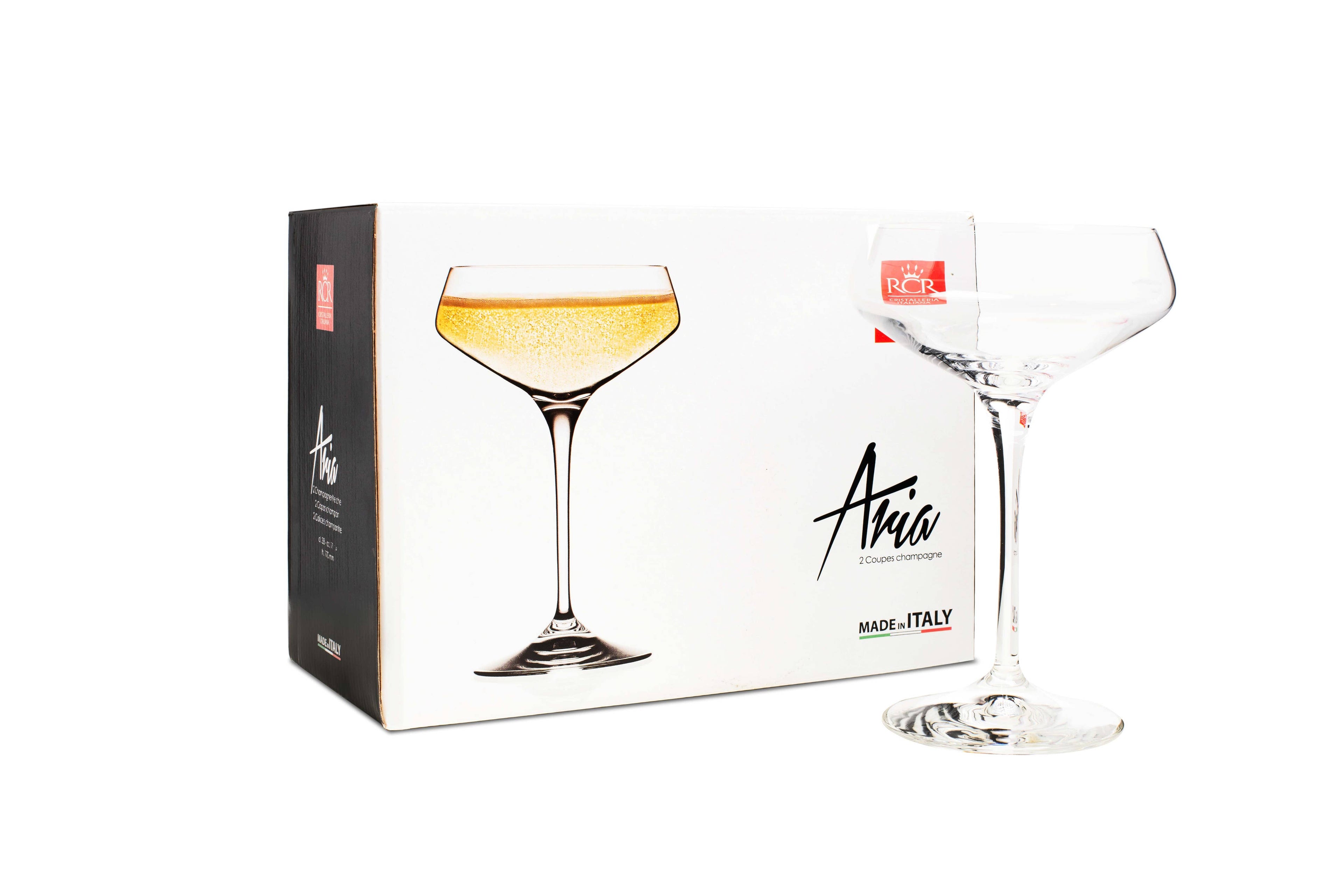 Champagnekupa i kristall bredvid sin originalförpackning från italienska RCR Cristalleria.